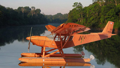A Ch801 floatplane resting on a river in the rainforest
