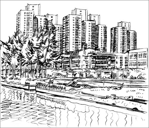 five tall block of flats stand behind lower buildings, in the front flows a river